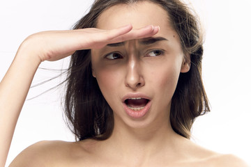 Fototapeta premium Woman surprised, woman holding her hand near forehead on isolated background