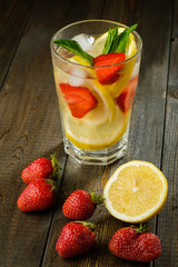 Lemonade with lemon and strawberry, mint and ice