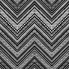 Seamless ethnic pattern drawn by hand. Black and white vector illustration.