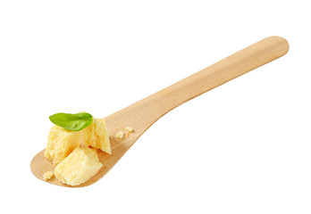 Parmesan cheese on wooden spatula