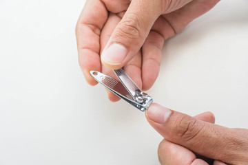 close up man use nail clipper for sanitary