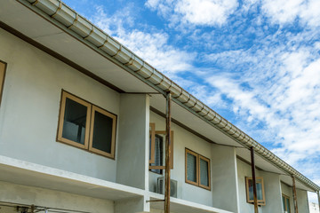 Home with cloudy sky
