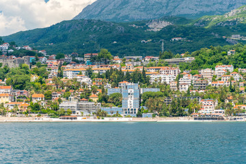 Obraz premium A sea yacht arrives to the city of Herceg Novi in Montenegro along the Adriatic Sea.
