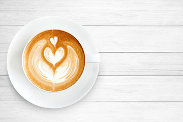 Top view latte art coffee on wood background