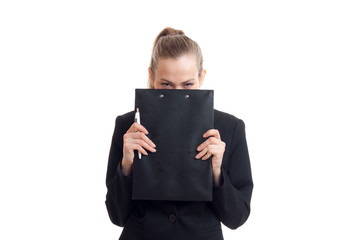 Business woman in classic black uniform hide her face behind a tablet