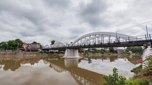 Timelapse the ratsadapisek bridge of the world war2 at the wang river in the city of Lampang in North Thailand