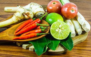 Various vegetables and seasoning cooking ingredients Tom Yum Soup or River Prawn Spicy Sour Soup (Tom Yum Goong) on  wooden background,Healthy eating and diet food concept.