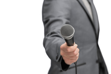 Interviewer or reporter with microphone in hand, mic