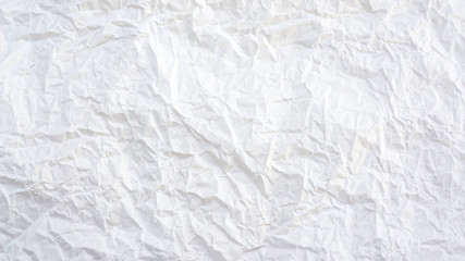 White creased paper background texture.