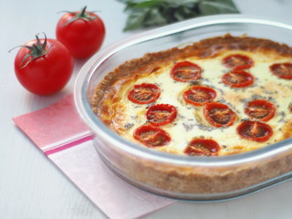 Rustic custard pie with vegetables and cheese. Traditional quiche pastry.