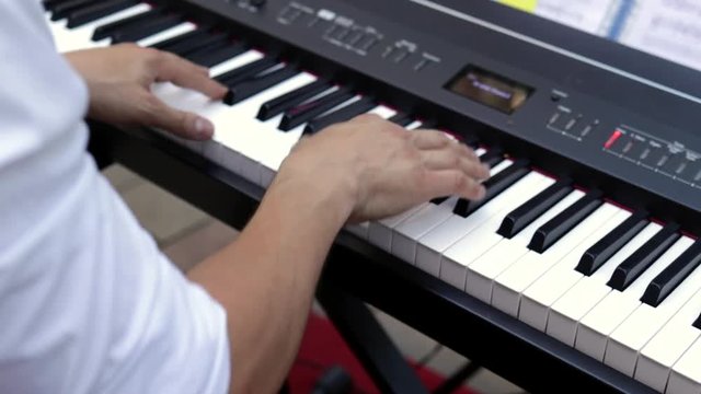 Musician playing piano in a jazz performance.