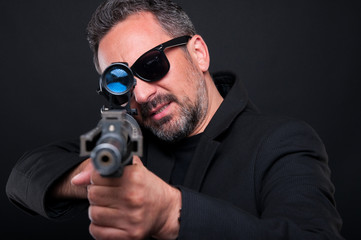 Mafia murderer aiming his weapon