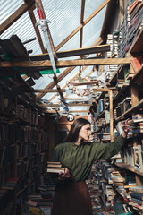 Fototapeta na wymiar Vertical image of girl in library