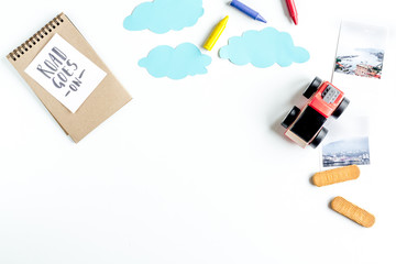 children tourism outfit with toys and note on white background flat lay mockup