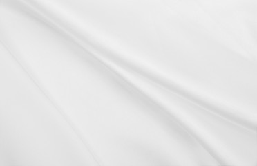 Smooth elegant white silk or satin luxury cloth texture as wedding background. Luxurious background design