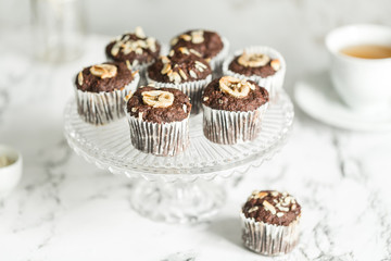 Chocolate muffins with banana and tea