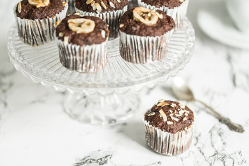 Chocolate muffins with banana and tea
