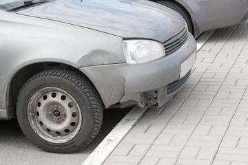 the rumpled car wing after accident