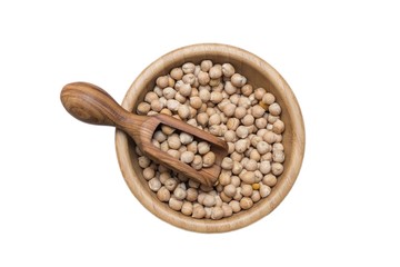 Red rice and olive wood scoop on black background of slate or stone. 