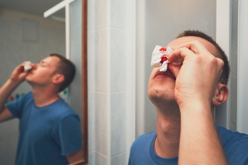 Man with nose bleed