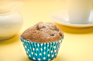 blue, tasty cupcake on a yellow background/blue, tasty cupcake and sunlight