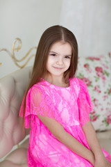 Portrait of pretty little girl in dress