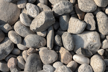 Perpendicular photo of white river pebbles