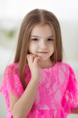Portrait of pretty little girl in dress