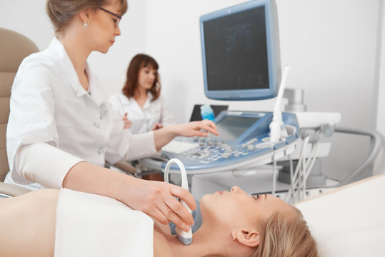 Shot Of A Female Patient Getting Ultrasound Scanning At The Hospital Medicine Clinical Survey Technology Modern Equipment Computer Specialist Endocrinology Concept.