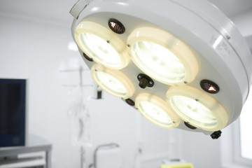 Close up shot of a surgical lamp in operating theatre at the hospital copysapce equipment...