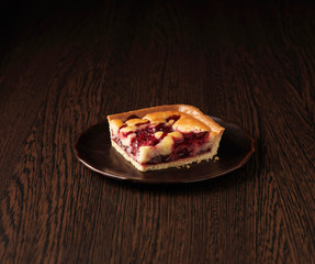 Slice of morello cherry frangipane tart
