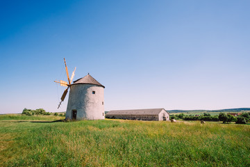 Old dutch windmill on field