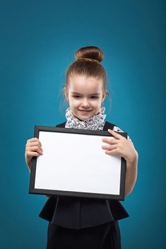 Little Child With Papers Dressed Like Teacher