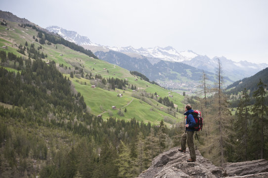 Man hiking near Engstligen falls, Adelboden, Bernese Oberland, Switzerland