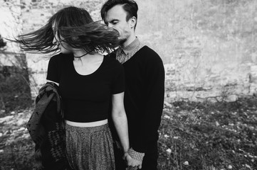 couple in love near the brick wall