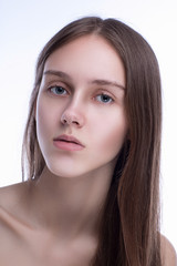 Fototapeta premium Concept of beauty and skin care. Beautiful caucasian woman with perfect looks in the studio on white isolated background, Perfect skin