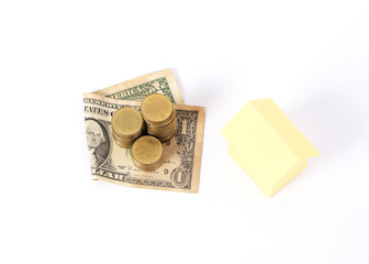 Doallar and money coins stack and Yellow home paper for Loans Concept