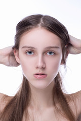 Fototapeta premium Concept of beauty and skin care. Beautiful caucasian woman with perfect looks in the studio on white isolated background, Perfect skin