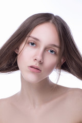 Fototapeta premium Concept of beauty and skin care. Beautiful caucasian woman with perfect looks in the studio on white isolated background, Perfect skin