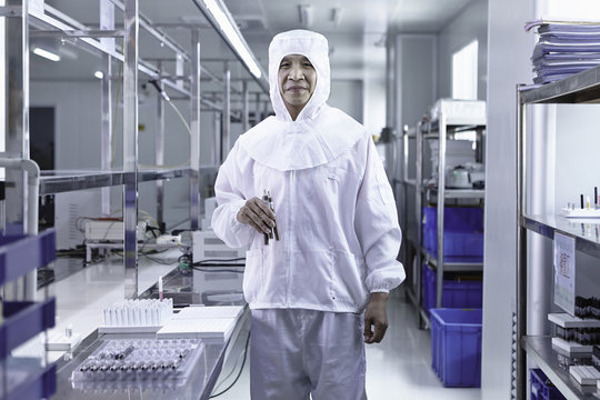 Worker testing ecigarettes in ecigarette factory