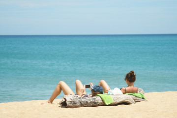 lady sunbathing  on the beach