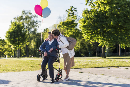 Happy Senior Couple With Balloons