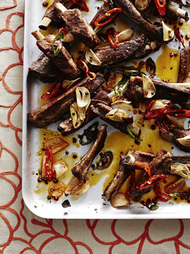 Close up of roasting tin of Chengdu lu rou - ribs with chillies