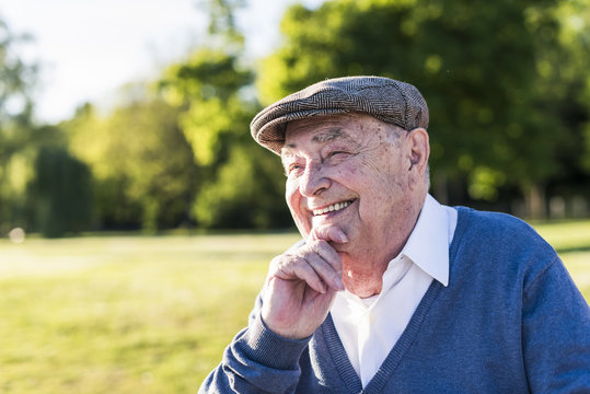 Portrait of smiling senior man wearing cap