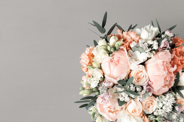 luxurious and elegant bouquet of roses and Other flowers. Composition colors on gray background. Copy space.