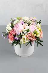 luxurious and elegant bouquet of roses and Other flowers. Composition colors on gray background. Copy space.