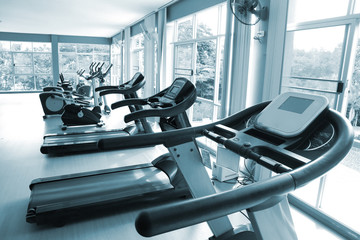 Fototapeta premium treadmill exercise running track machine in fitness room