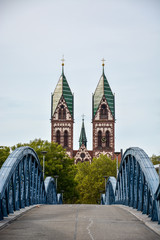 The "Herz-Jesu-Kirche" in Freiburg, Germany and a bridge