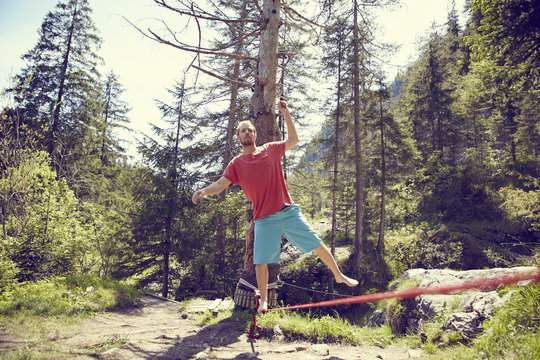 Man balancing on rope, Ehrwald, Tyrol, Austria