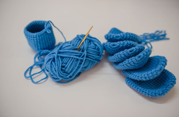 Closeup blue knitting on White background .